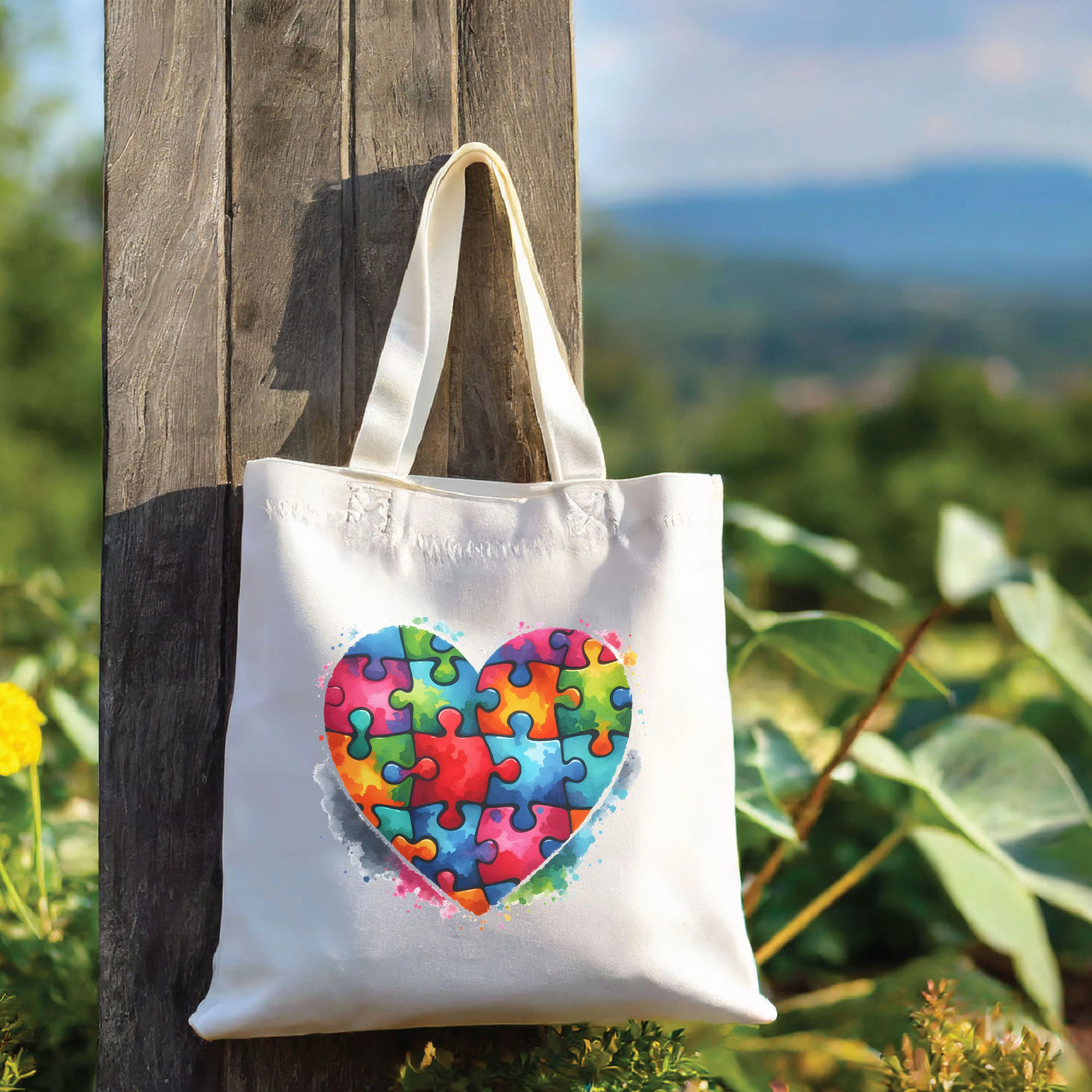 a tote bag with a heart made of puzzle pieces