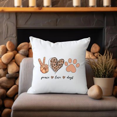 a white pillow sitting on top of a couch next to a potted plant