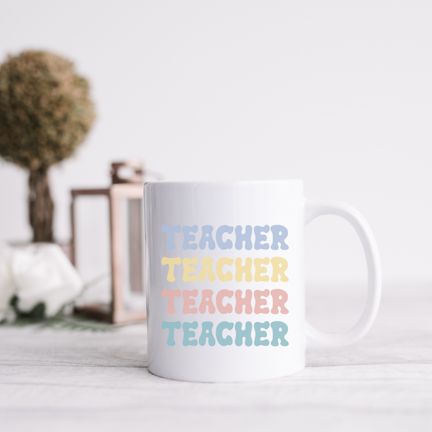 a white coffee mug sitting on top of a table