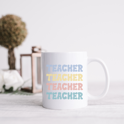 a white coffee mug sitting on top of a table