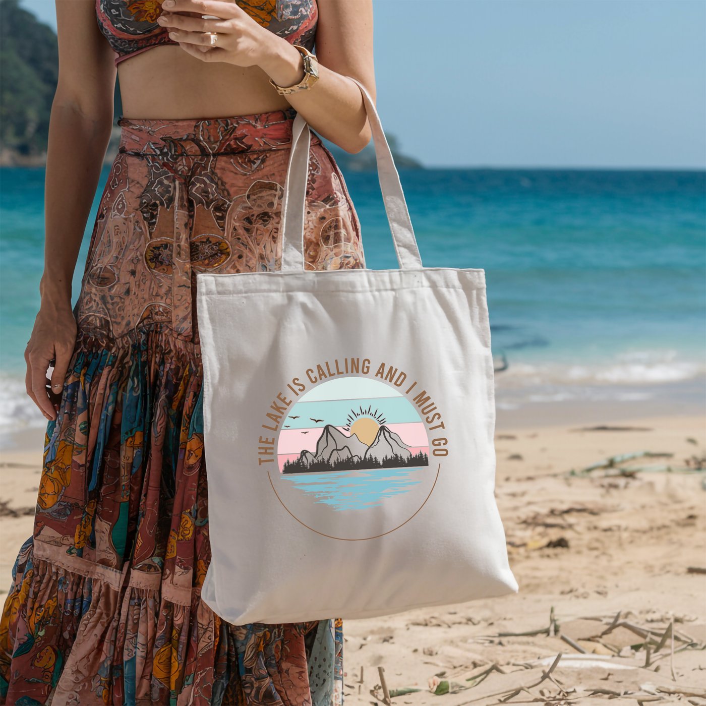 a woman standing on a beach holding a white bag