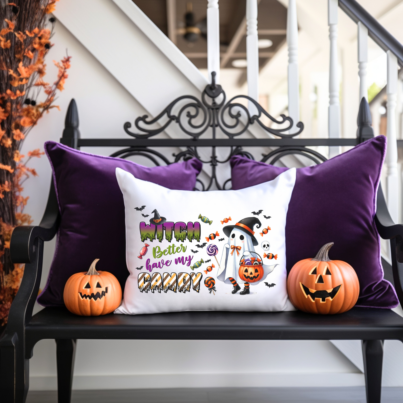 a bench with two pumpkins and a pillow on it