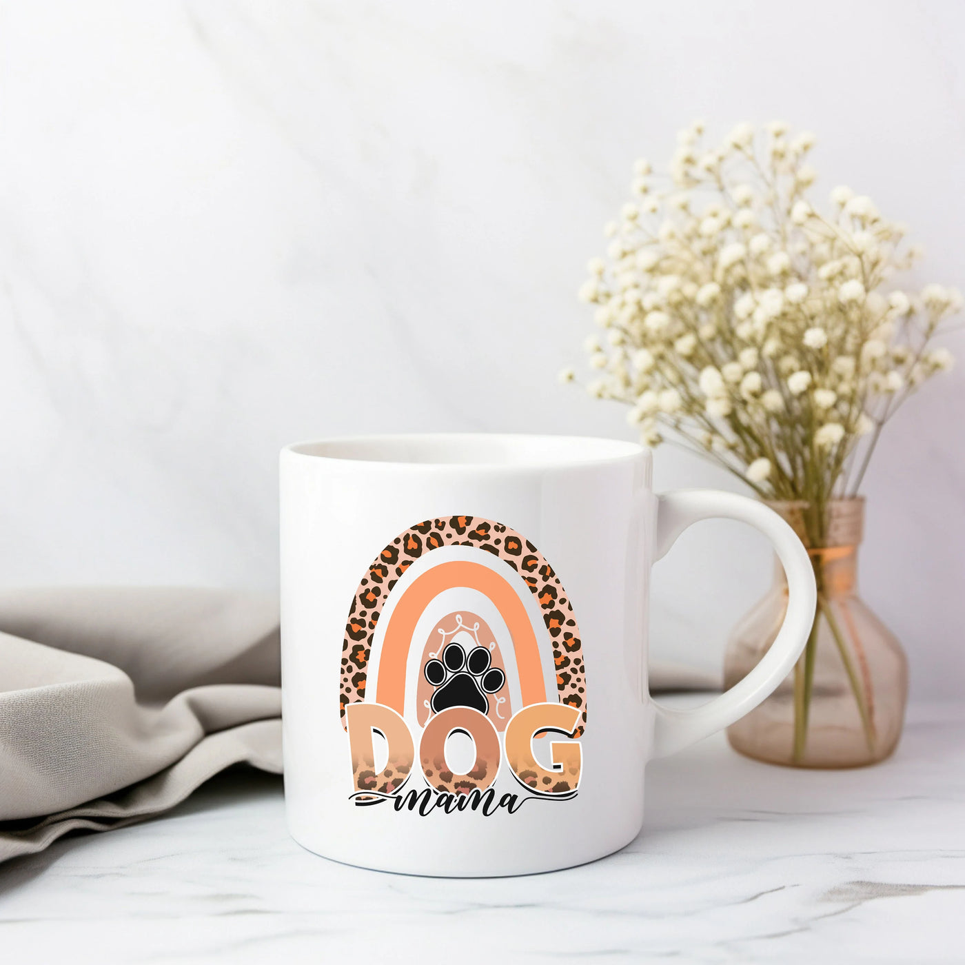 a white coffee mug with a dog's paw on it