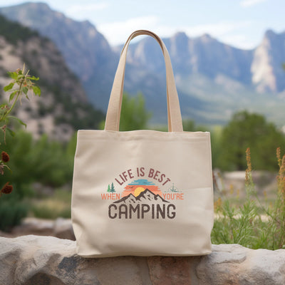 a tote bag sitting on top of a rock