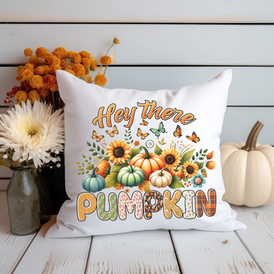 a white pillow that says hey there pumpkin