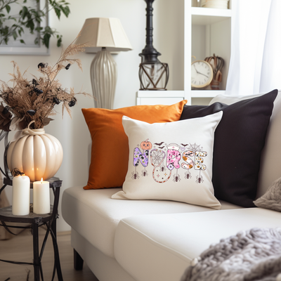 a living room with a white couch and pillows