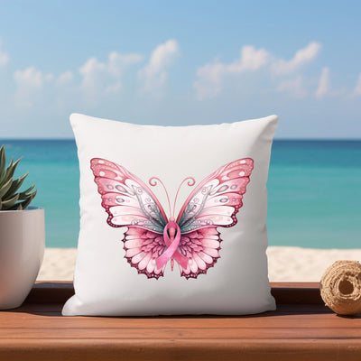 a white pillow with a pink butterfly on it