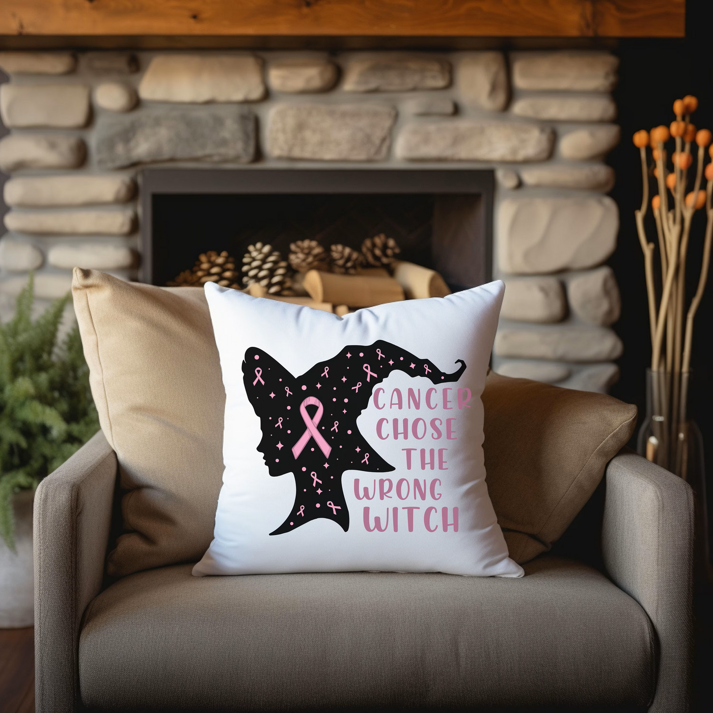 a pillow that has a pink ribbon on it