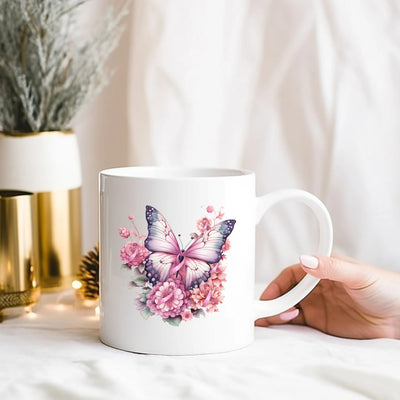 a person holding a coffee mug with a butterfly on it