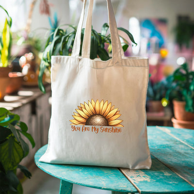 a white tote bag with a sunflower on it