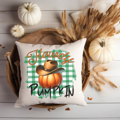 a white pillow with a happy pumpkin on it