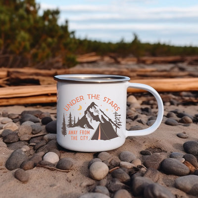 a camp mug sitting on top of a pile of rocks