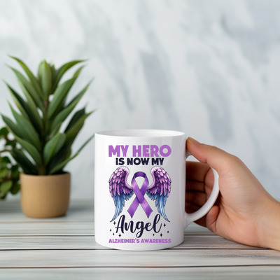 a person holding a coffee mug with a purple ribbon on it