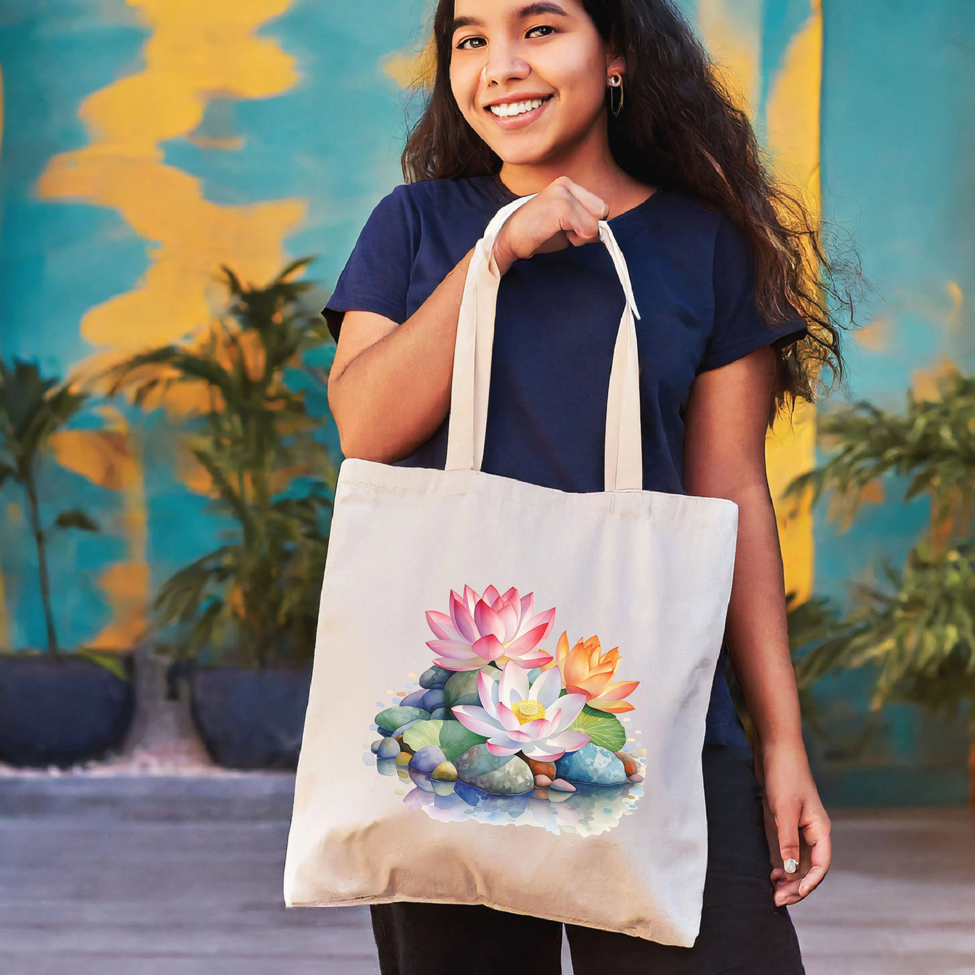 a woman holding a bag with a picture of a flower on it