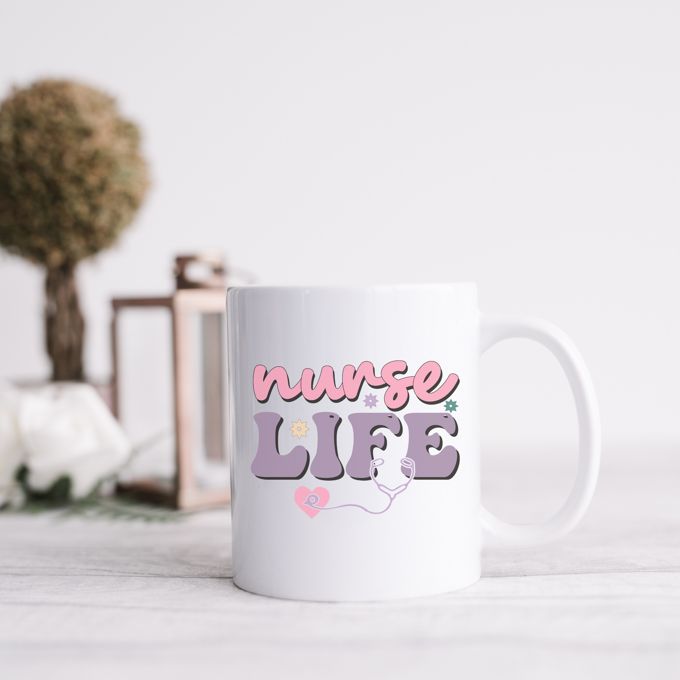 a white coffee mug with the words nurse life on it