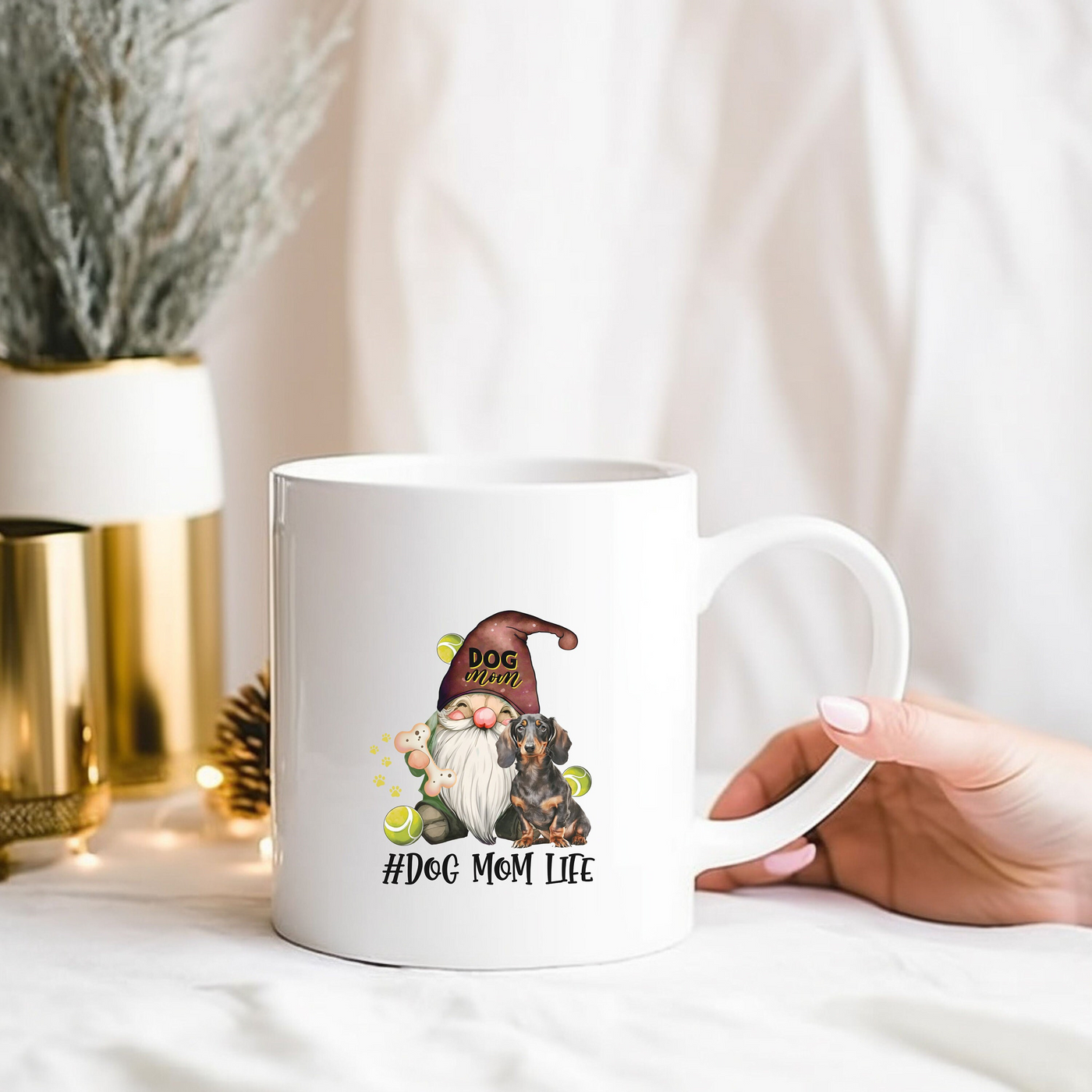 a person holding a coffee mug with a gnome on it