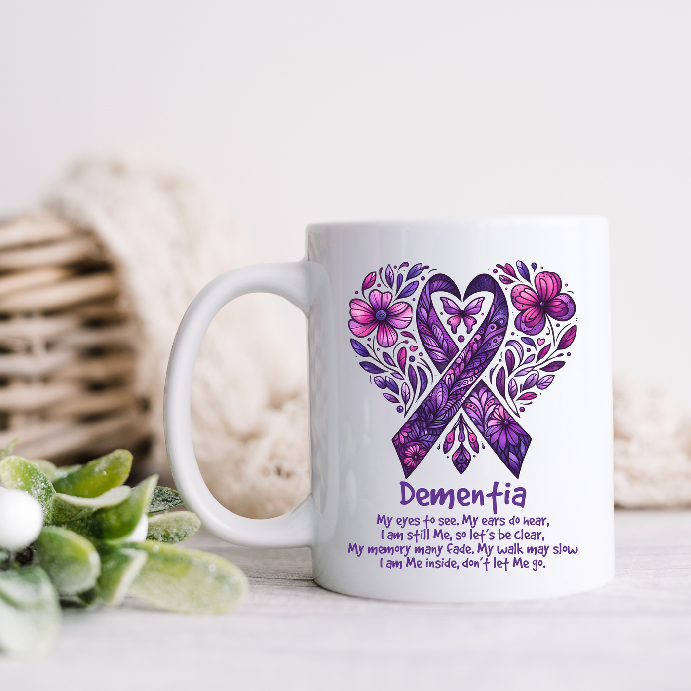 a white coffee mug with a purple ribbon on it