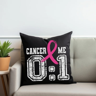 a black pillow with a pink ribbon on it