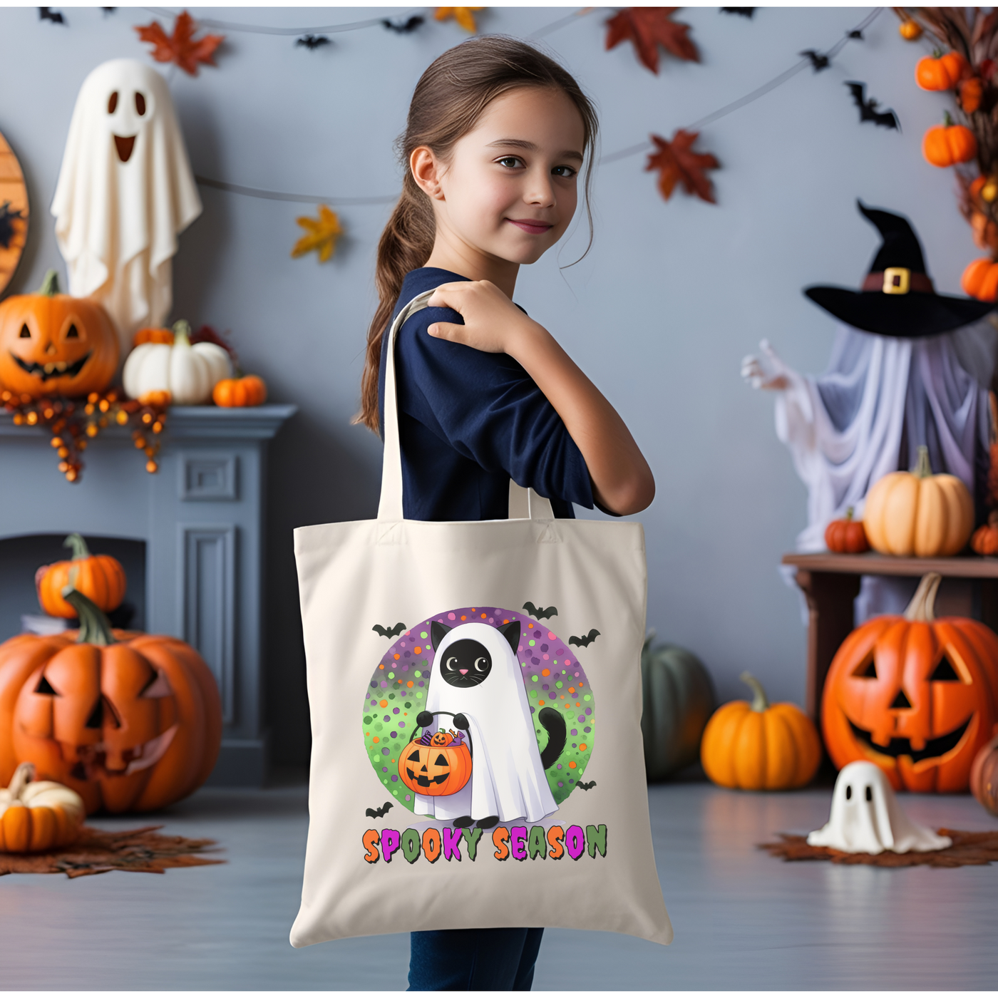 a little girl holding a trick or treat bag