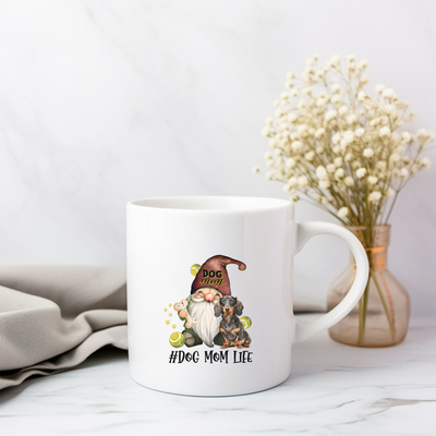 a white coffee mug with a gnome on it