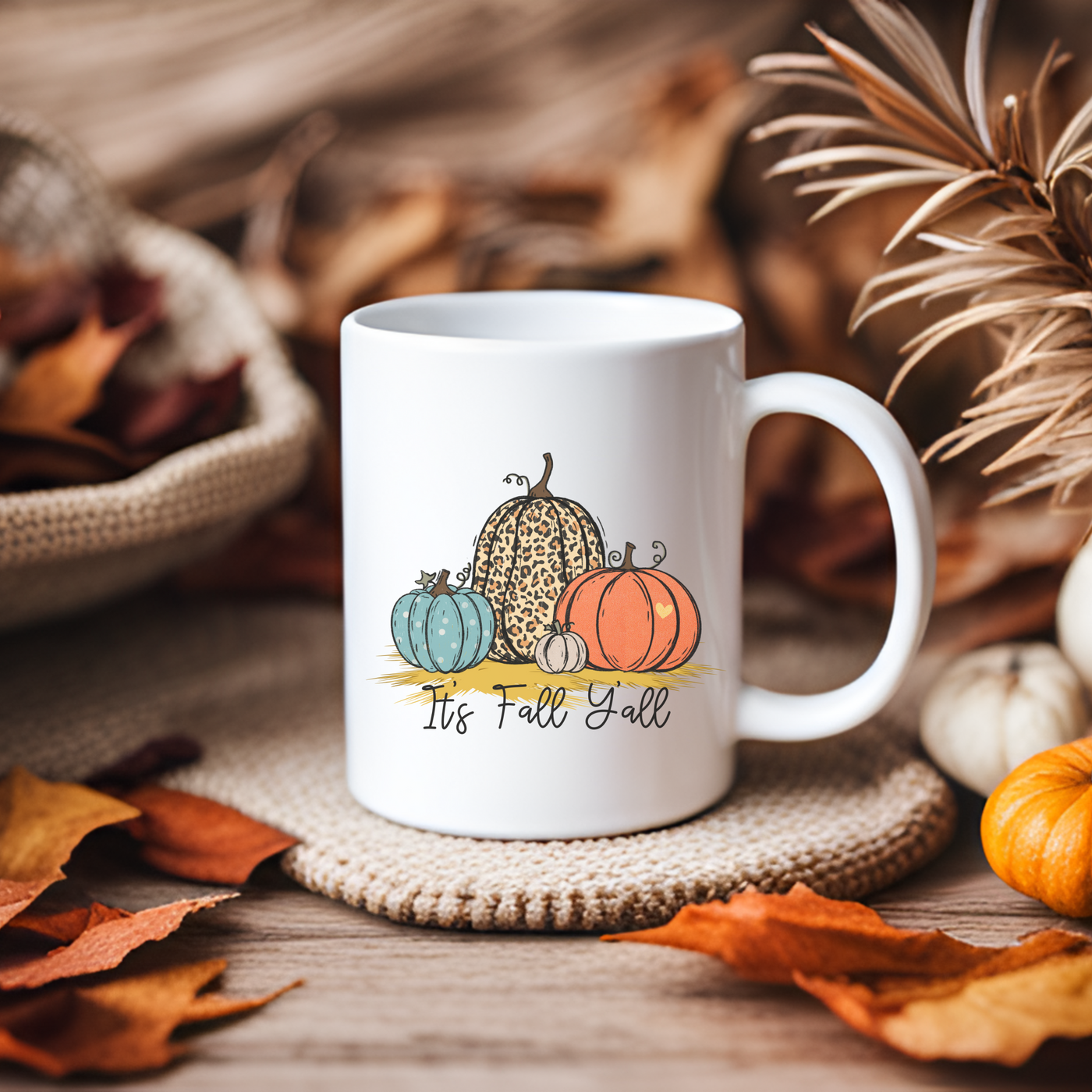 a white coffee mug sitting on top of a table