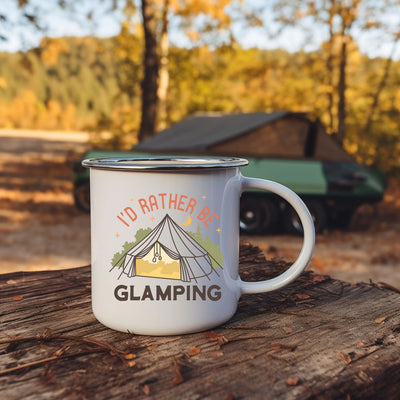 a camper mug sitting on top of a tree stump