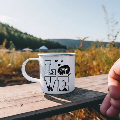 a person holding a coffee mug with the words love on it