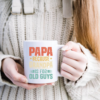 a woman is holding a coffee mug with the words papa because grandpa is for old