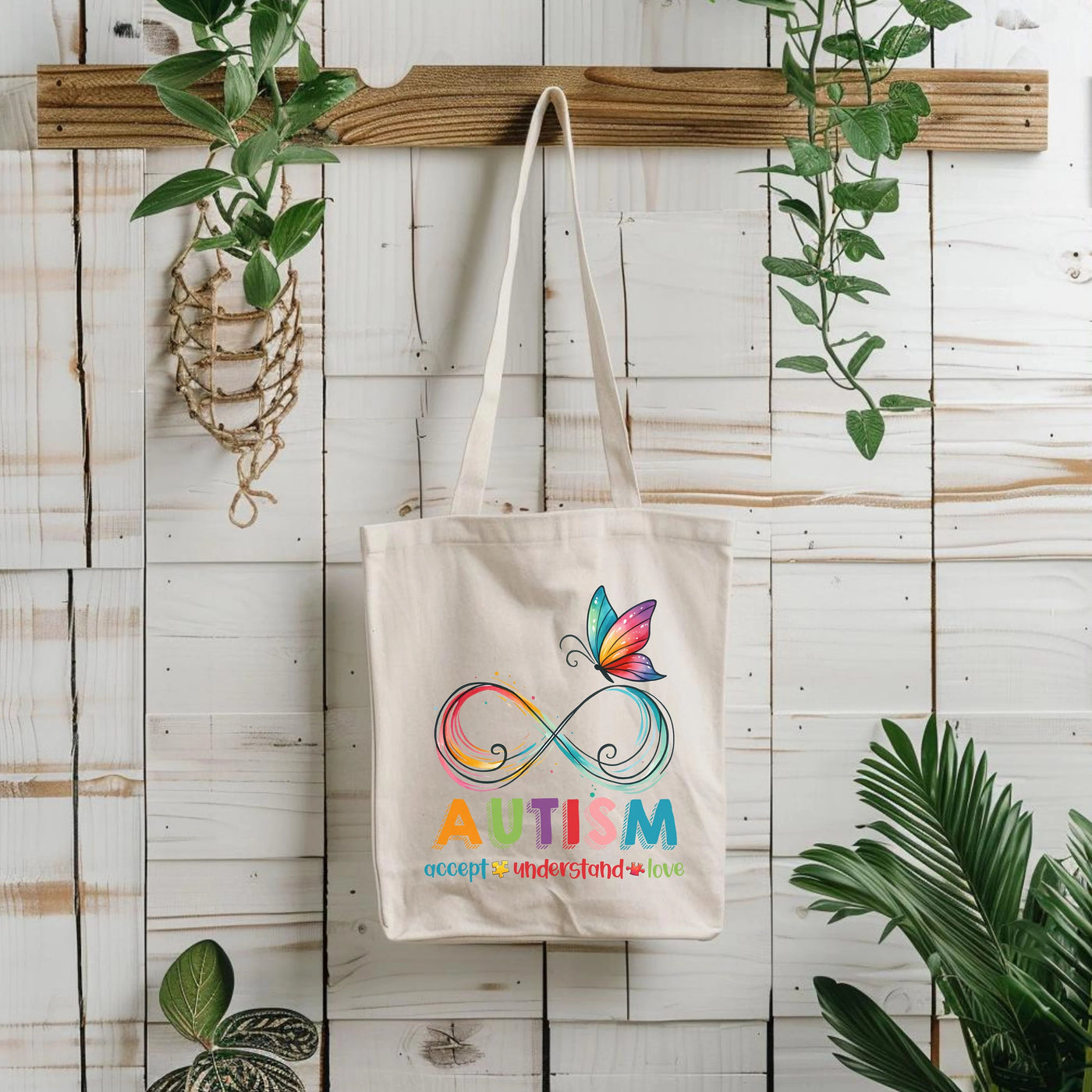 a tote bag hanging on a wall next to a potted plant