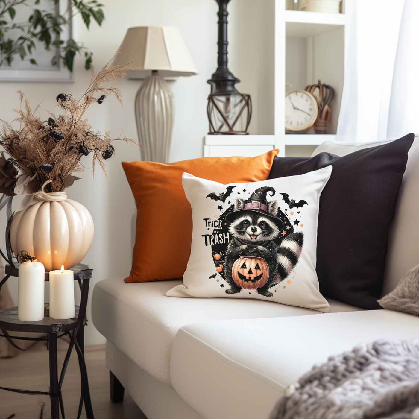 a living room with a white couch and halloween decorations