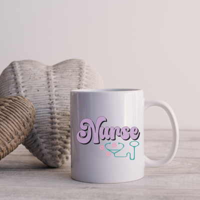 a white coffee mug sitting on top of a wooden table