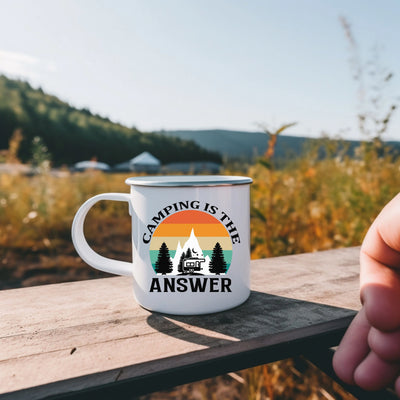 a person holding a coffee mug on a wooden table