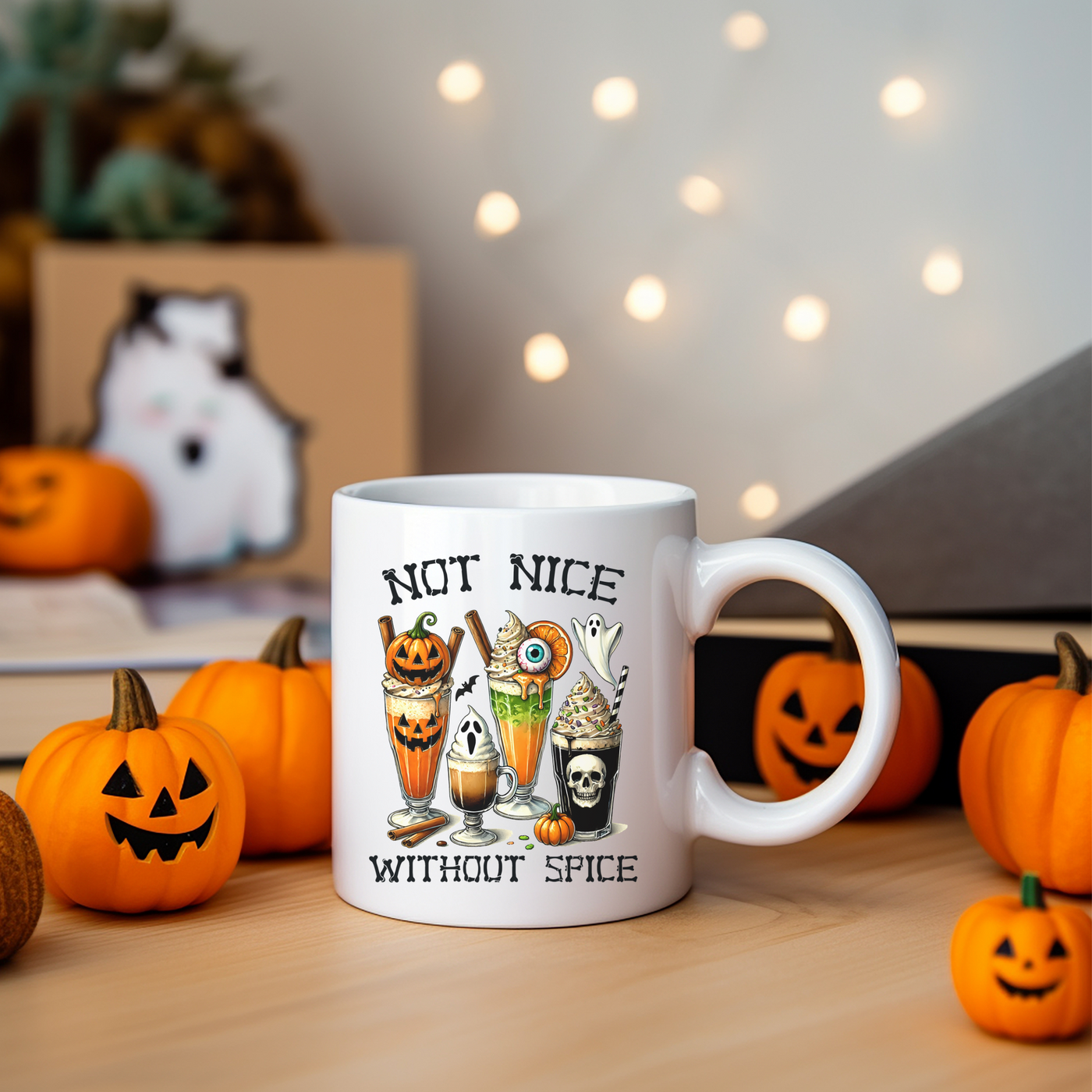 a white coffee mug with halloween images on it