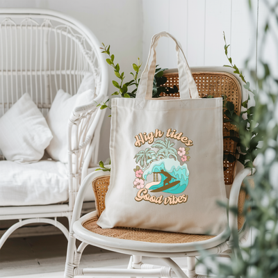 a tote bag sitting on top of a chair next to a potted plant