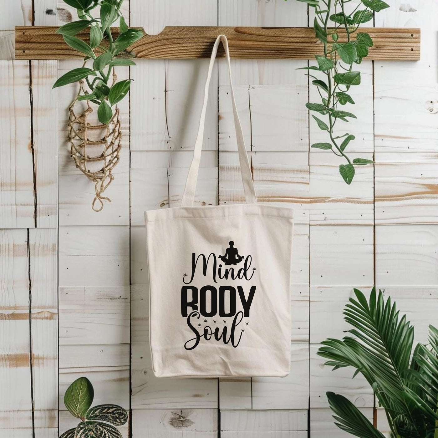 a tote bag hanging on a wall next to a potted plant