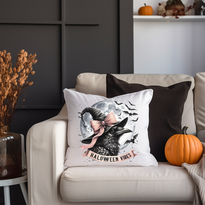 a white couch with a halloween pillow on it