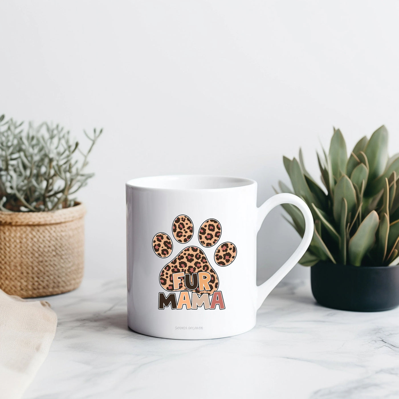 a white coffee mug with a leopard print on it