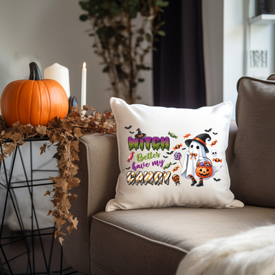 a couch with a halloween pillow on it