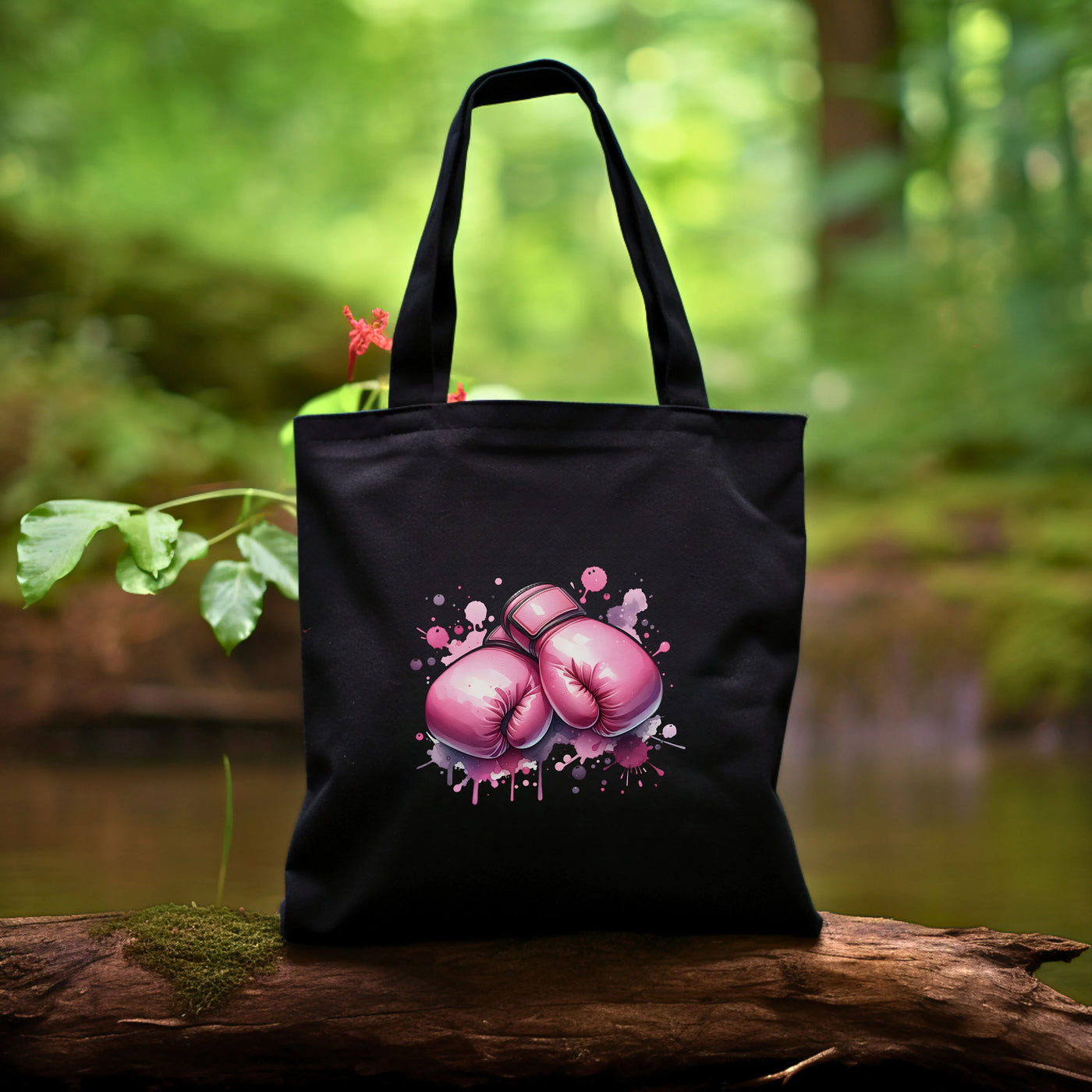 a black bag with pink boxing gloves on it