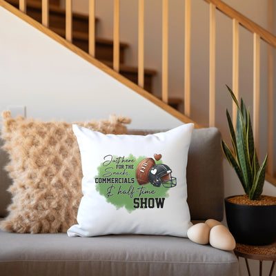 a couch with a pillow and a potted plant