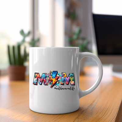 a white coffee mug sitting on top of a wooden table