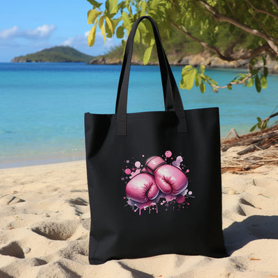 a black bag with pink boxing gloves on it