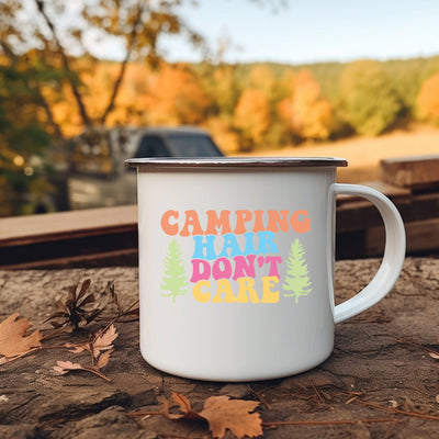 a camper mug sitting on the ground with the words camping hair don't