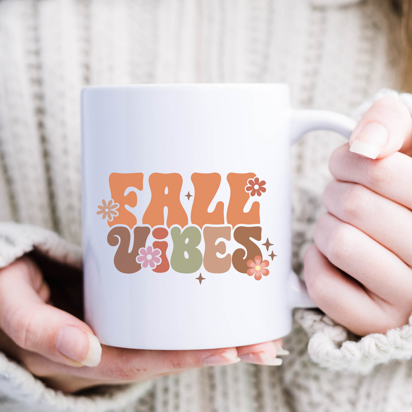 a woman holding a white coffee mug with the word fair vibe on it