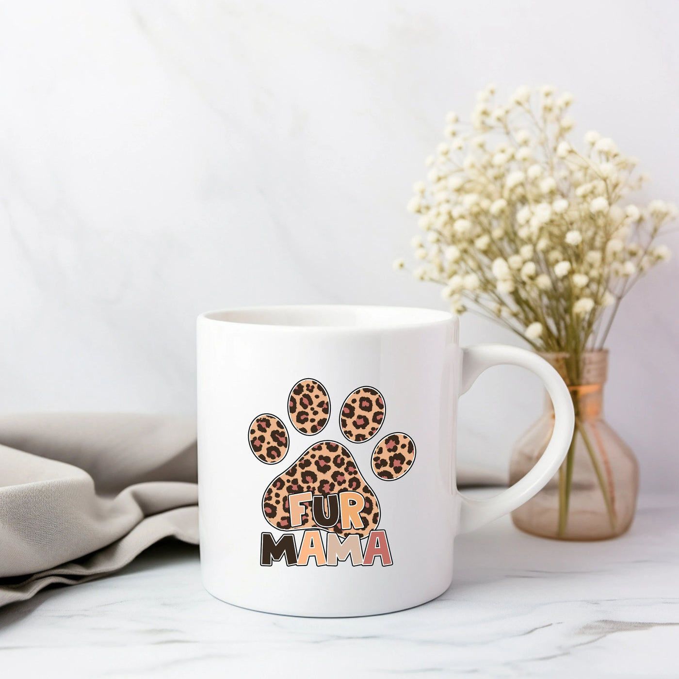 a white coffee mug with a leopard print on it