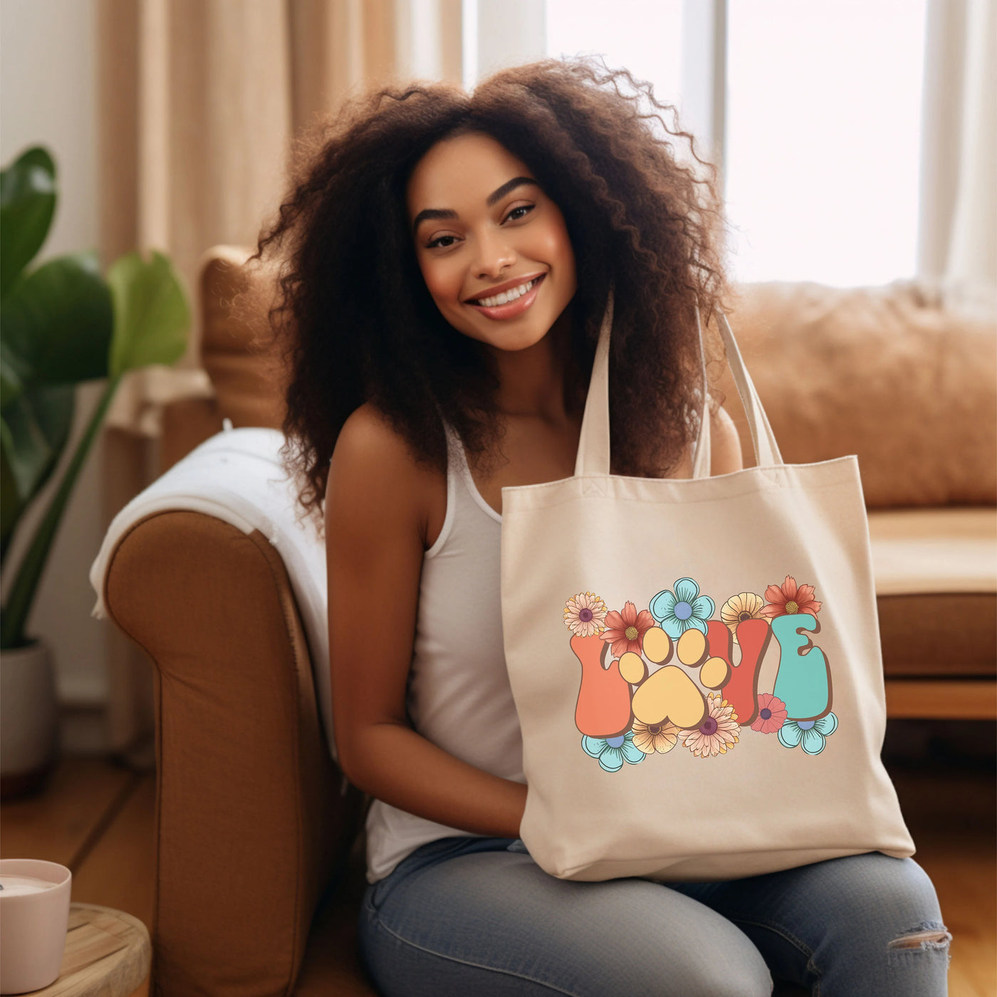 a woman sitting on a couch holding a tote bag