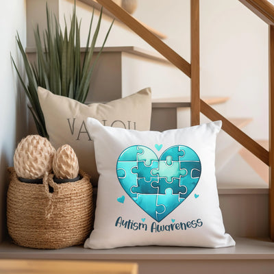 a white pillow with a puzzle heart on it