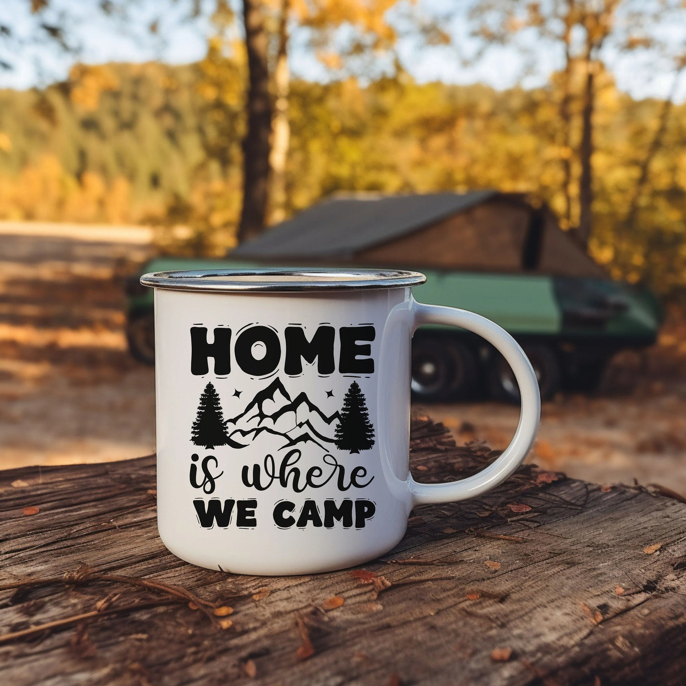 a camper mug sitting on top of a tree stump