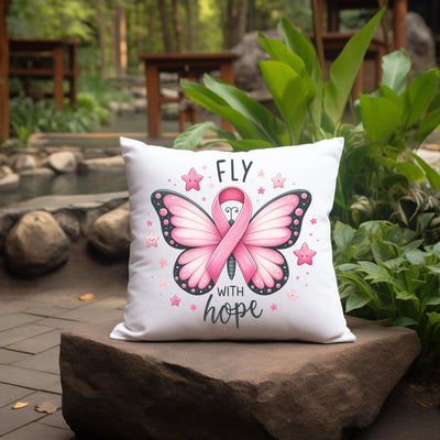 a pillow that has a pink butterfly on it