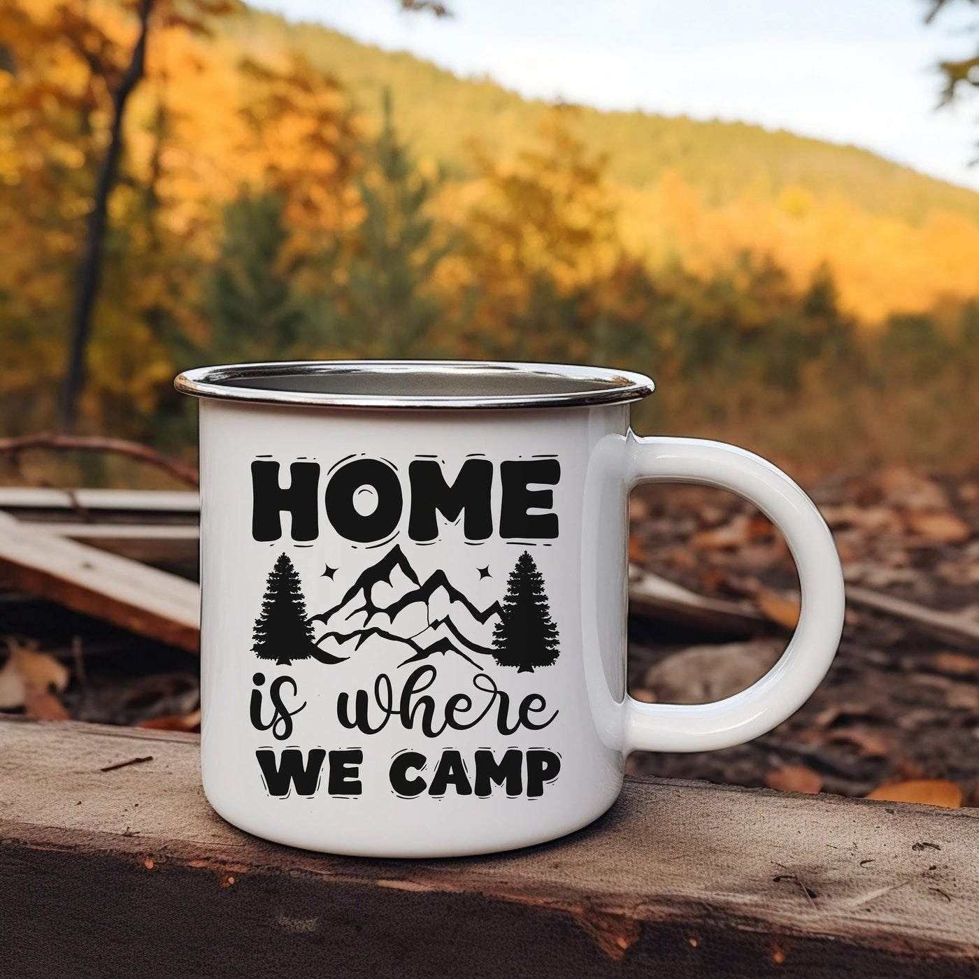 a white camp mug sitting on top of a wooden table